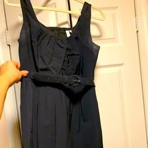 Navy cocktail dress with belt.